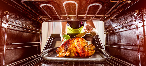 Chicken cooking in an oven