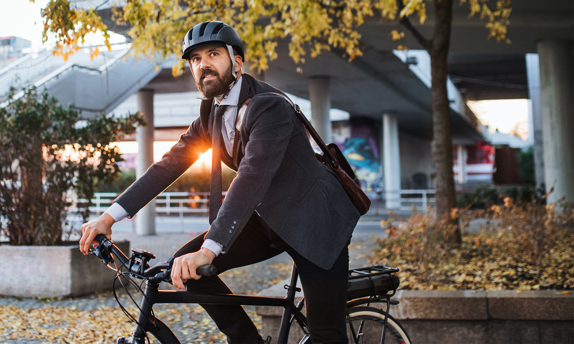 Commuter in suit on electric bike